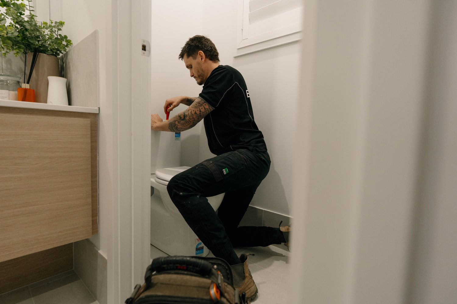 Bathroom plumbing repair in progress